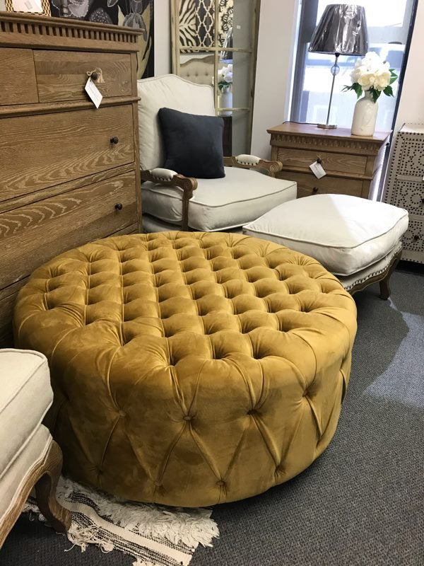 Round Tufted Ottoman Mustard/ Castors